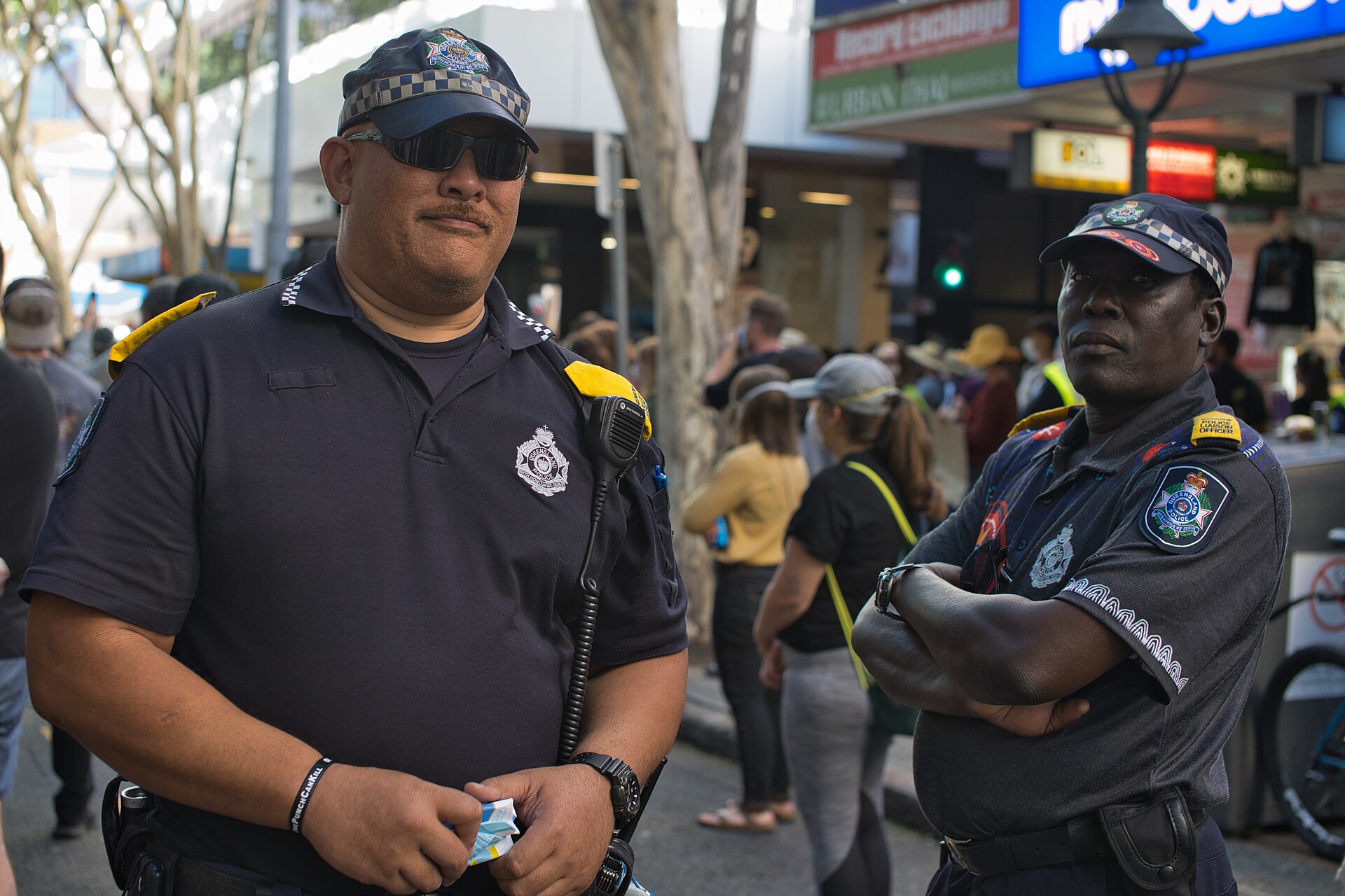 Queensland Police Community Liaison Offers watching over the Anti-Racism Protest in Brisbane, Queensland, Australia. 6 June 2020. This protest was in support of Black Lives Matter and associated protests in the United States following the killing of George Floyd - but also highlighted parallel issues within Australia such as the deaths of Australia's aboriginal people while in police custody. Unlike the corresponding US protests, police presence at this event was generally low-key and seemed to focus on traffic control and welfare of protestors. Although the large gathering exceeded the maximum allowed by Queensland State Government during the COVID-19 pandemic, no action was taken.